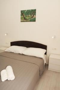 Postel nebo postele na pokoji v ubytování Apartmani Eni