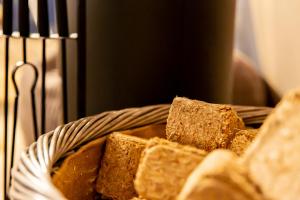 a basket filled with bread sitting next to a stove at Finest Retreats - Hever Luxury Dome 