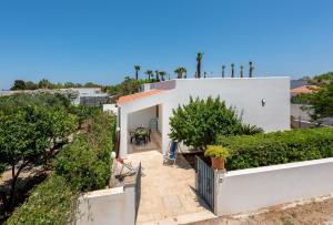 an aerial view of a white house with trees at Casa Vacanza Azzurra 2 in San Vito lo Capo