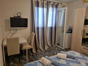 Postel nebo postele na pokoji v ubytování Rooms Anđelka