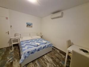 Postel nebo postele na pokoji v ubytování Rooms Anđelka