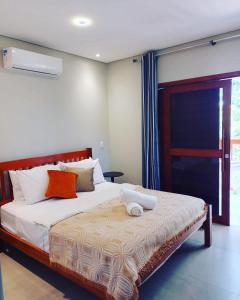 Tempat tidur dalam kamar di Casa Verde Maré