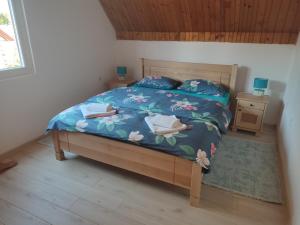 Postel nebo postele na pokoji v ubytování Apartman DoM