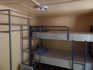 a room with three bunk beds in it at Oasis Country Park in Rugat