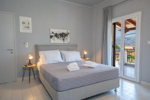 Posteľ alebo postele v izbe v ubytovaní Mary's Studios & Apartment + 10 fotografií