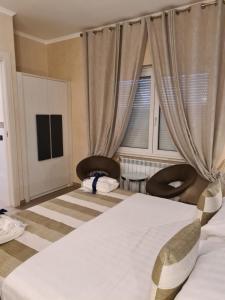 Postel nebo postele na pokoji v ubytování Albis Rooms Guest House