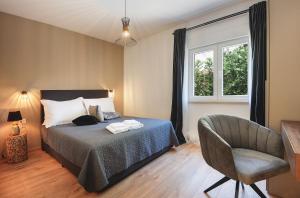 Posteľ alebo postele v izbe v ubytovaní Vila Una with private pool near Rovinj - open 2022 + 33 fotografií