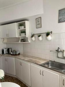 A kitchen or kitchenette at Apartamento Trav. Santa Luzia
