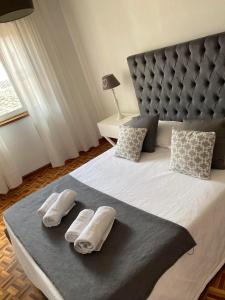 מיטה או מיטות בחדר ב-Apartamento Trav. Santa Luzia