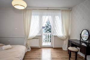 Posteľ alebo postele v izbe v ubytovaní Noclegi Handzel