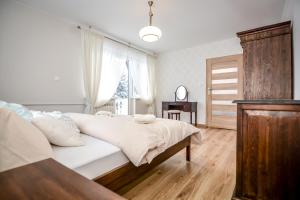 Posteľ alebo postele v izbe v ubytovaní Noclegi Handzel