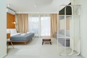 Valen Mare Suites客房内的一张或多张床位