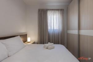 Ένα ή περισσότερα κρεβάτια σε δωμάτιο στο Seaview 2 Bedroom Beach Apartment