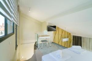 Valen Mare Suites客房内的一张或多张床位