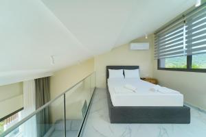 Valen Mare Suites客房内的一张或多张床位