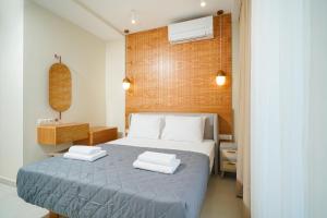Valen Mare Suites客房内的一张或多张床位