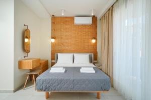 Valen Mare Suites客房内的一张或多张床位