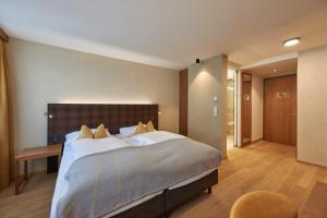 Letto o letti in una camera di Après Post Hotel