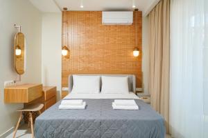 Valen Mare Suites客房内的一张或多张床位
