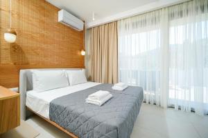 Valen Mare Suites客房内的一张或多张床位