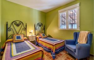 A bed or beds in a room at Awesome Home In Montefrío