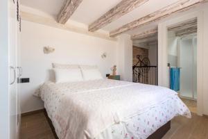 Posteľ alebo postele v izbe v ubytovaní APARTAMENTO VINTAGE EN EL CENTRO DE MÁLAGA