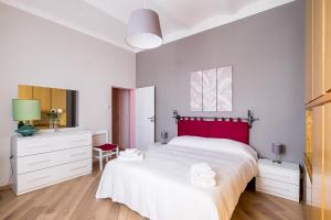 A bed or beds in a room at Navile Family Apartment by Wonderful Italy