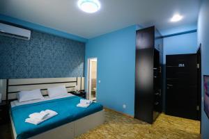 Voodi või voodid majutusasutuse Hotel Sagu toas