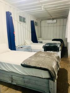 Postel nebo postele na pokoji v ubytování Peace Hostel MX