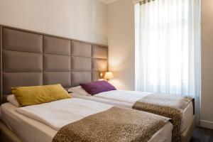 Ένα ή περισσότερα κρεβάτια σε δωμάτιο στο Hotel Alexandra