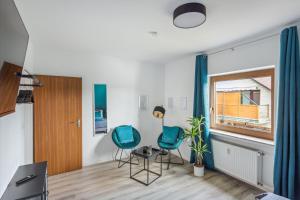 Χώρος καθιστικού στο Charysma - Weserufer, stylish, Schlafzimmer mit Smart-TV, 2 Parkplätze