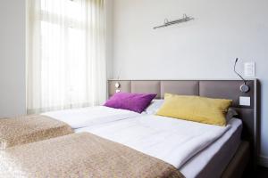 Ένα ή περισσότερα κρεβάτια σε δωμάτιο στο Hotel Alexandra