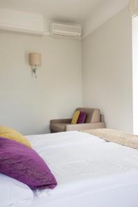 Ένα ή περισσότερα κρεβάτια σε δωμάτιο στο Hotel Alexandra