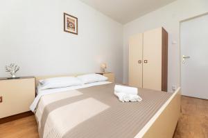 Postel nebo postele na pokoji v ubytování Apartmani Jašarević