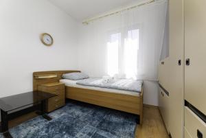 Postel nebo postele na pokoji v ubytování Apartmani Jašarević