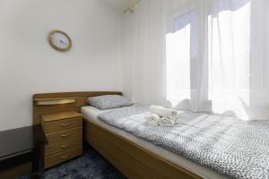 Postel nebo postele na pokoji v ubytování Apartmani Jašarević