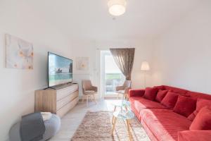TV a/nebo společenská místnost v ubytování Grenzhaus am See