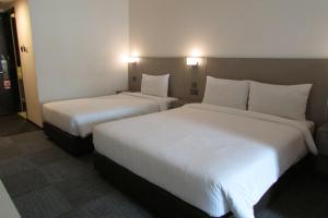 Letto o letti in una camera di Strand Hotel