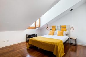 A bed or beds in a room at Stunning and Spacious Lofts just by Graça and Alfama