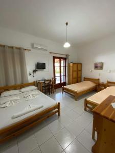 Posteľ alebo postele v izbe v ubytovaní Archontika Apartments