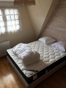 Postel nebo postele na pokoji v ubytování Maison Place manemeur