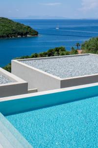 a swimming pool with a view of the ocean at Sivota Deamaris Luxury Boutique Hotel in Syvota