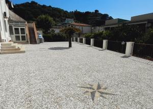 a star on the ground in front of a house at Sindaro house in Messina