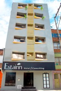 a building with a guitar on the side of it at Estainn Hotel Coworking in Bogotá