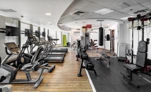 a gym with treadmills and elliptical machines at Water Front Blue Lguna Garden Apartment 2bd in Herzliya B