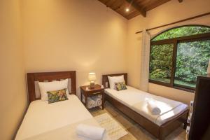 A bed or beds in a room at Three Bedroom Two Bath Villa on 20 Acres of Nature! "Hana's Celeste Retreat"