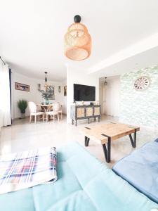 a living room with a couch and a table at Vista Mar in Puerto del Rosario