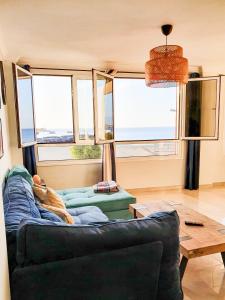 a living room with a couch and a table at Vista Mar in Puerto del Rosario