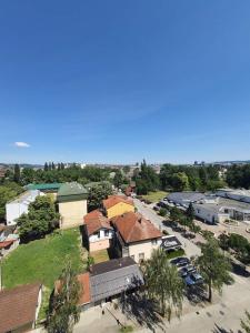 an overhead view of a town with houses and cars at Apartman Nataša BL in Banja Luka