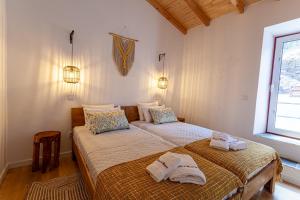 Un pat sau paturi într-o cameră la Varandas de Monsaraz